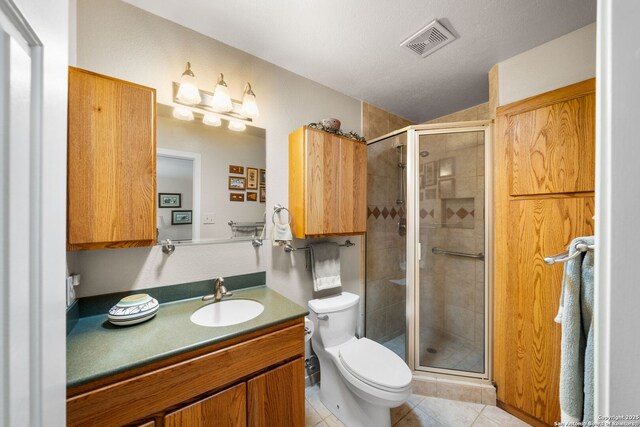 full bath featuring visible vents, toilet, a shower stall, tile patterned flooring, and vanity