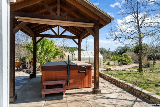 view of patio with a gazebo and a hot tub