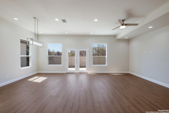 unfurnished living room with visible vents, baseboards, recessed lighting, wood finished floors, and a ceiling fan