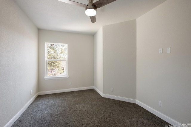 empty room with baseboards, a ceiling fan, and dark colored carpet