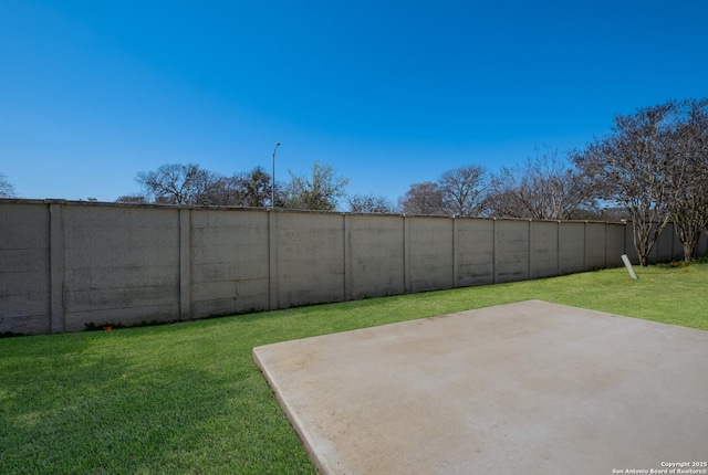 view of yard with a patio and a fenced backyard