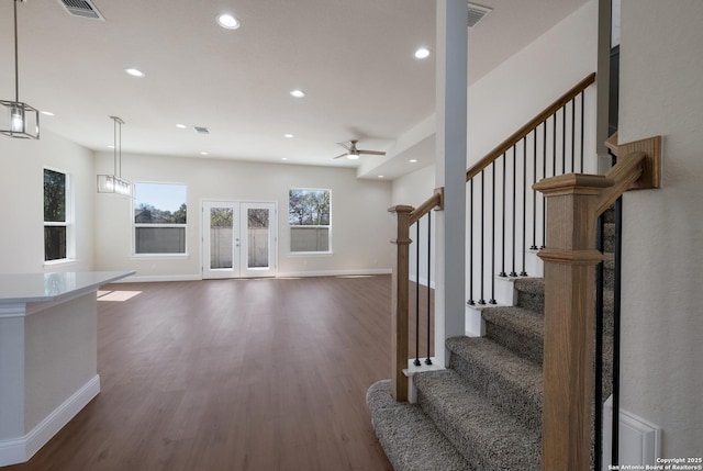 interior space with recessed lighting, baseboards, wood finished floors, and a ceiling fan