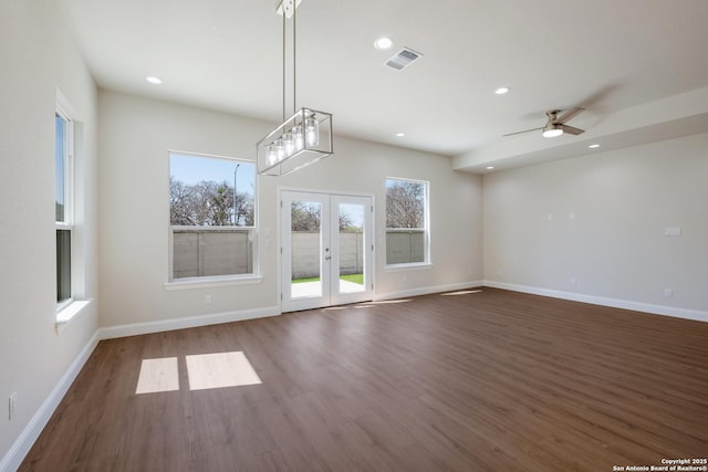 interior space with a wealth of natural light, visible vents, recessed lighting, and wood finished floors