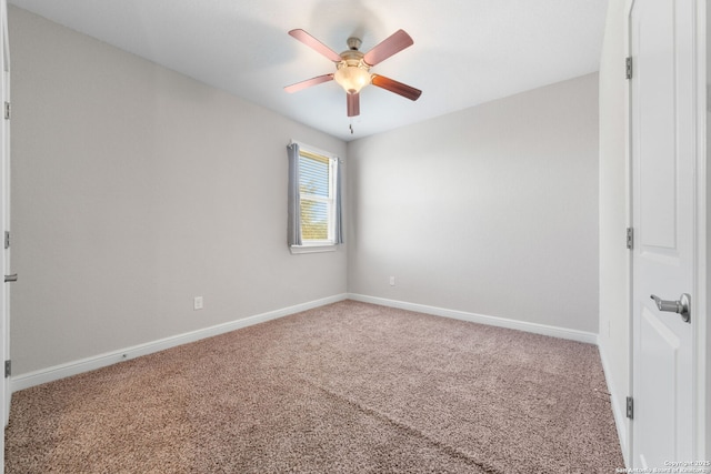 empty room with baseboards, carpet floors, and ceiling fan