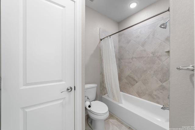 full bathroom with tile patterned flooring, shower / bath combination with curtain, and toilet