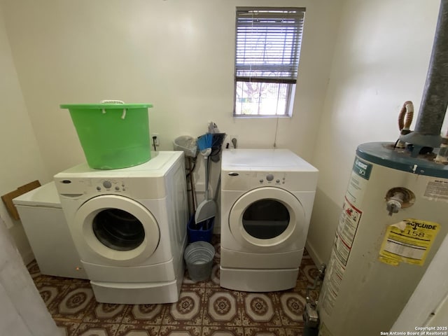 laundry area with water heater, laundry area, washer and dryer, and tile patterned flooring