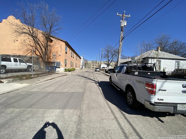 view of road with curbs and sidewalks