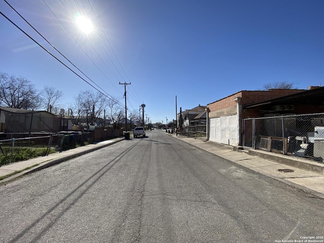 view of road with curbs and sidewalks