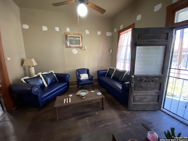 living area featuring wood finished floors, a ceiling fan, and a wall mounted AC