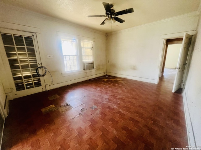 unfurnished bedroom with cooling unit, a ceiling fan, wood finished floors, baseboards, and crown molding