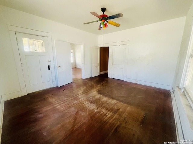 unfurnished bedroom with baseboards, ceiling fan, and wood finished floors