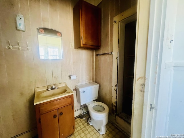 bathroom featuring tile patterned floors, toilet, and vanity