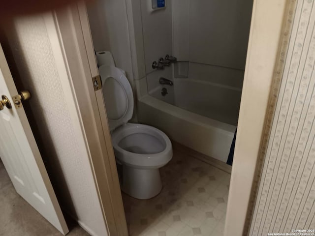 full bathroom featuring tile patterned floors, toilet, and shower / tub combination