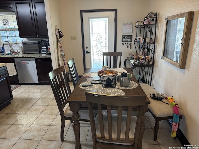 dining area featuring light tile patterned flooring