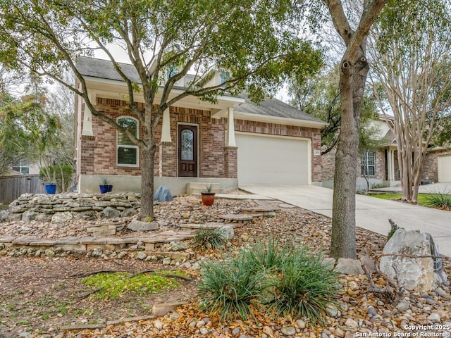 view of front of home with brick siding, concrete driveway, and a garage