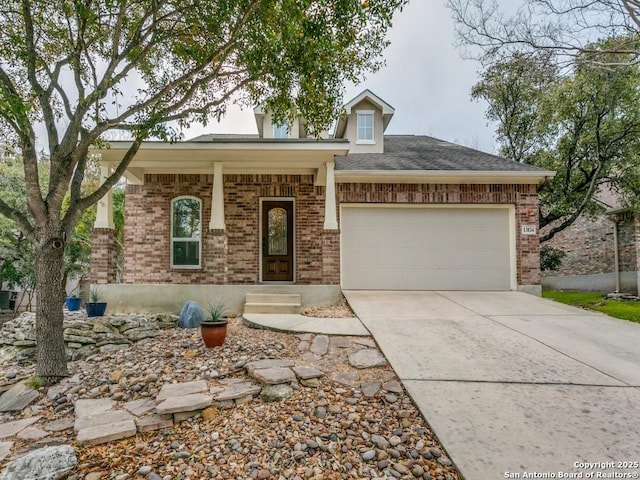 view of front of property with concrete driveway, an attached garage, brick siding, and a shingled roof