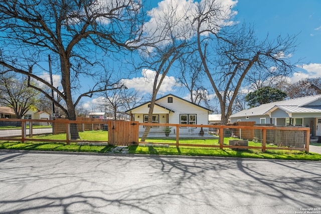 view of front of home with a gate and a fenced front yard