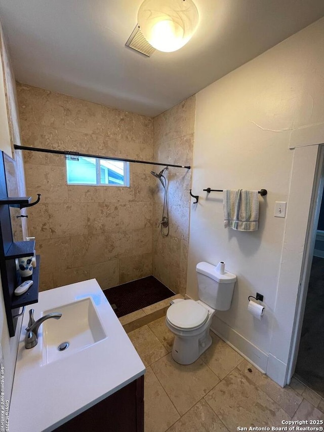 bathroom with vanity, visible vents, a stall shower, tile patterned floors, and toilet