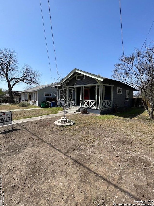 rear view of house with a porch