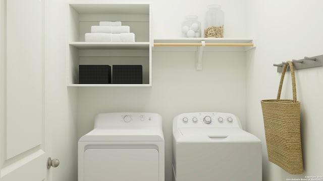 washroom featuring laundry area and washing machine and dryer