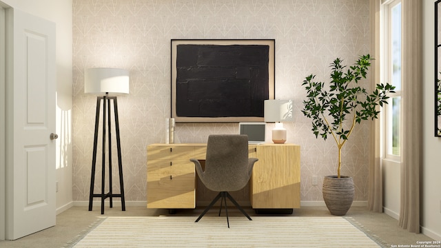 office space with wallpapered walls and baseboards