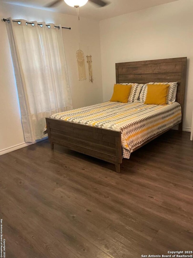 bedroom featuring a ceiling fan and wood finished floors