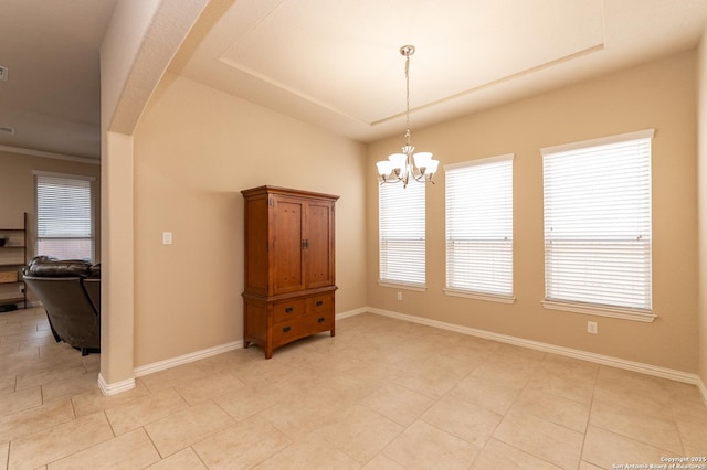 unfurnished room with a chandelier, light tile patterned floors, and baseboards