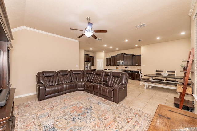 living area with visible vents, light tile patterned flooring, recessed lighting, ornamental molding, and ceiling fan