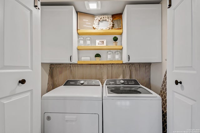 laundry room with cabinet space and independent washer and dryer