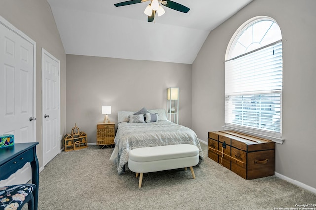 bedroom featuring lofted ceiling, carpet flooring, a ceiling fan, and baseboards