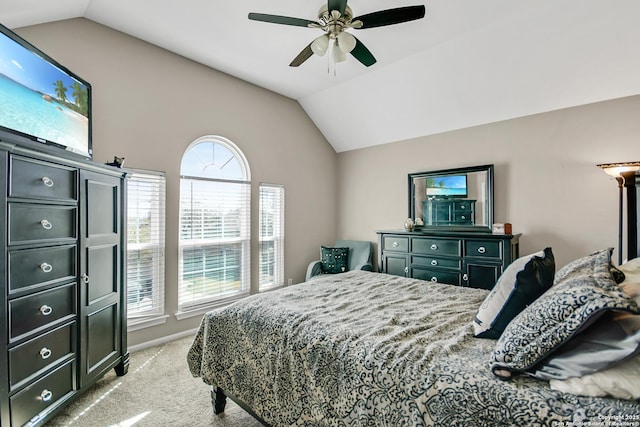 bedroom featuring lofted ceiling, a ceiling fan, and light carpet