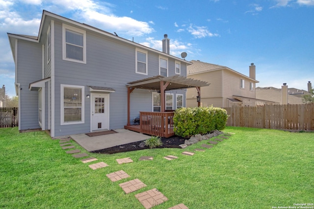 back of house featuring a patio, a pergola, a yard, and fence