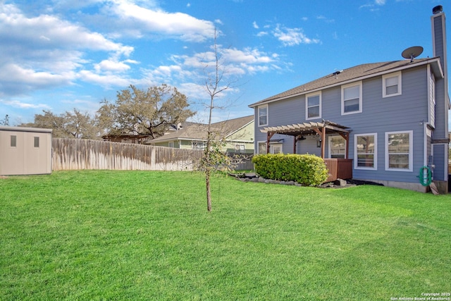 view of yard featuring a shed, a pergola, an outdoor structure, and fence