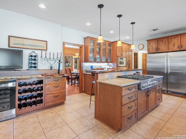 kitchen with visible vents, wine cooler, light tile patterned floors, stone counters, and appliances with stainless steel finishes