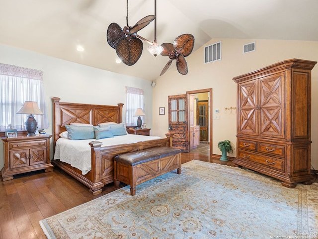 bedroom with visible vents, multiple windows, and hardwood / wood-style floors