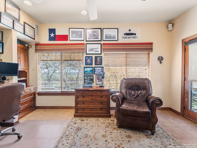 office with light tile patterned floors, baseboards, and a ceiling fan