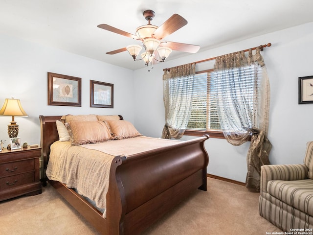 bedroom with baseboards, ceiling fan, and carpet flooring