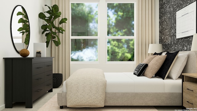 bedroom featuring light colored carpet