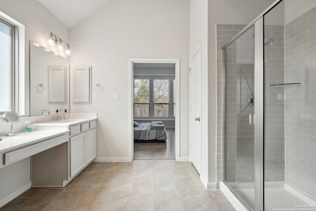 full bathroom featuring vanity, lofted ceiling, ensuite bath, a shower stall, and tile patterned floors