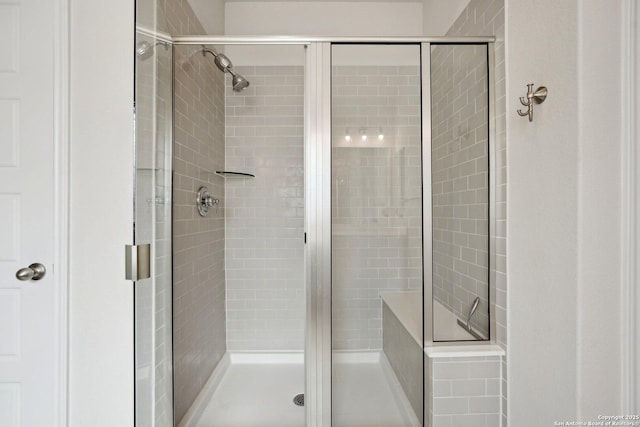 bathroom with a shower stall