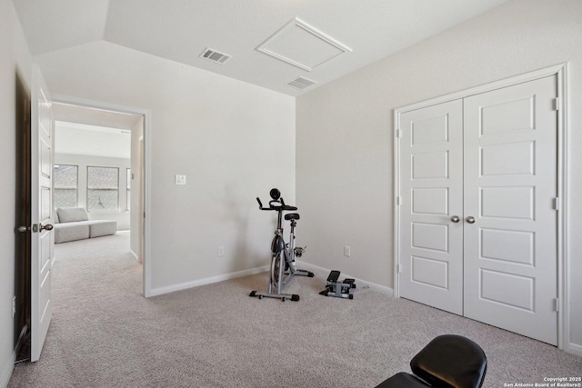 workout area featuring baseboards, visible vents, carpet floors, attic access, and lofted ceiling