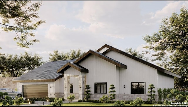 rear view of property with an attached garage and a yard