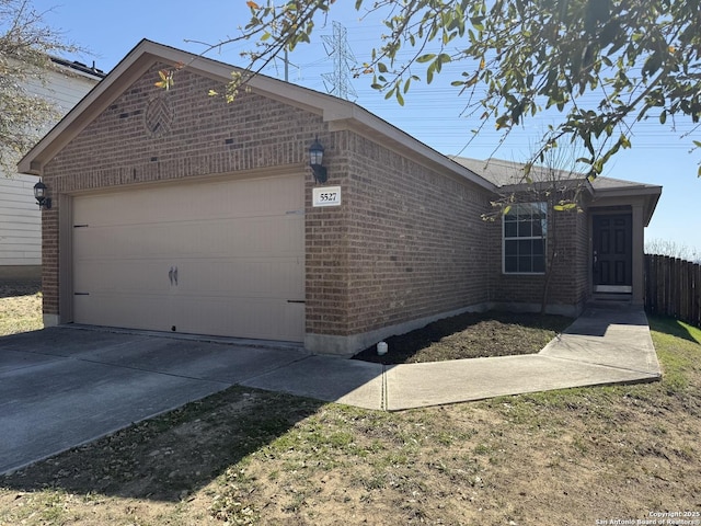 view of home's exterior featuring an attached garage and brick siding