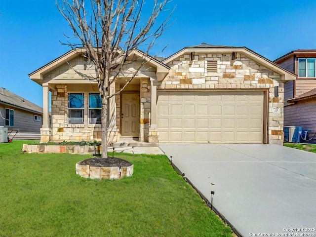 view of front facade with a garage, stone siding, a front lawn, and driveway