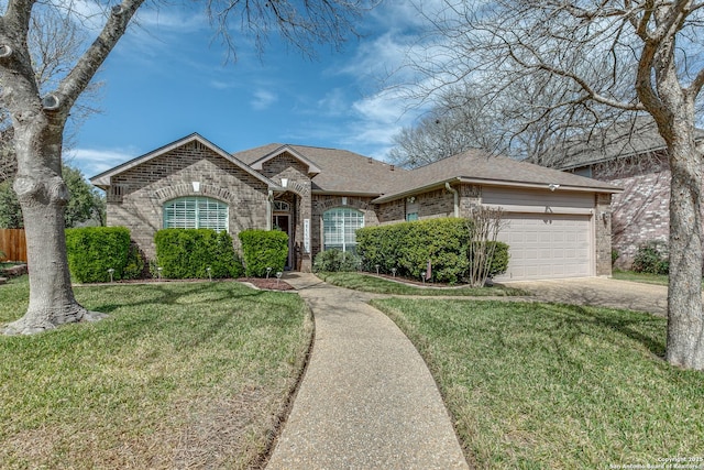 french country style house with concrete driveway, a front yard, a shingled roof, a garage, and brick siding