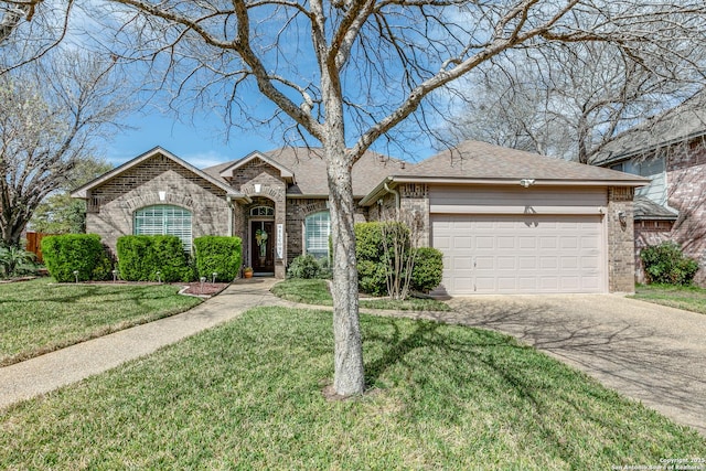 view of front of house with a front yard, an attached garage, and brick siding