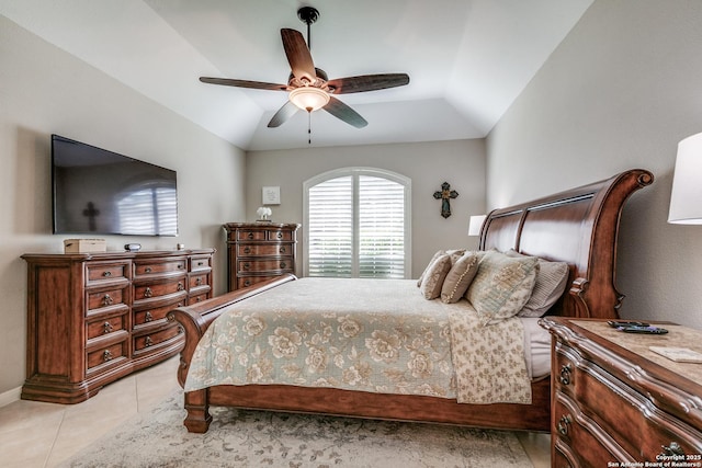 bedroom with light tile patterned floors, baseboards, ceiling fan, and vaulted ceiling