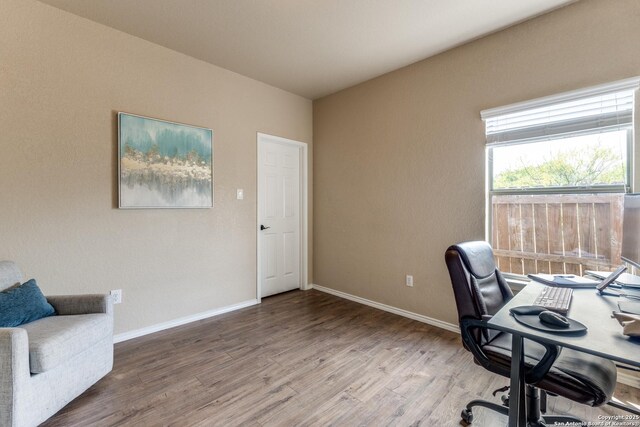 office featuring baseboards and wood finished floors