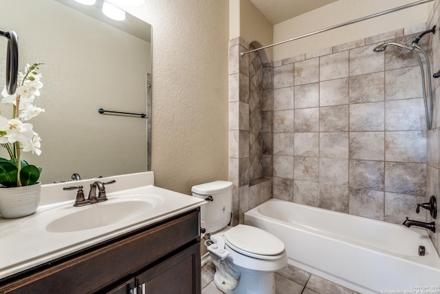 full bath with washtub / shower combination, a textured wall, toilet, vanity, and tile patterned flooring