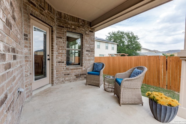 view of patio with fence